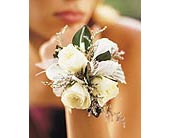 3 White Mini Roses Wristlet in Ellicott City MD, Wessel's Florist & Weddings